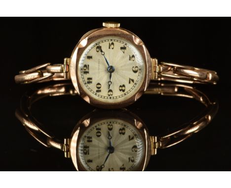 Collingwood 9ct gold ladies wristwatch with blued Breguet hands, black Arabic numerals, silver dial and unsigned movement, on