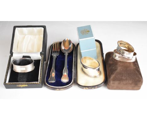 Cased Victorian hallmarked silver fork and spoon set, length of case 19cm, and four cased hallmarked silver napkin rings, wei