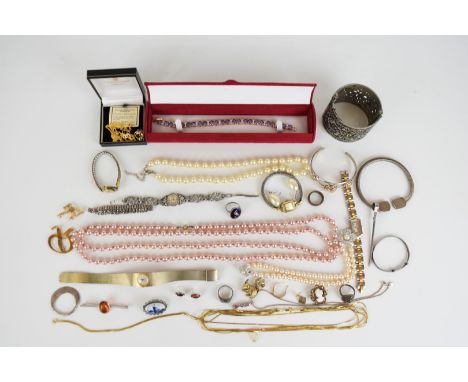 A collection of jewellery, some silver including bangle, christening bangle, brooch and earrings set with pressed amber, two 