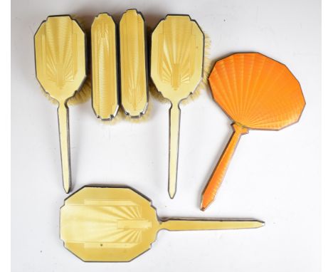 Art Deco hallmarked silver and yellow guilloch&eacute; enamel dressing table set comprising hand mirror and two pairs of brus