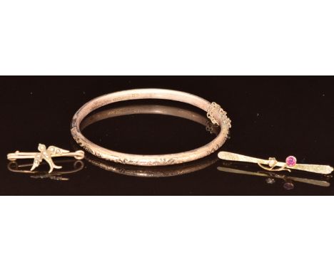 A 9ct gold bangle and two 9ct gold Edwardian brooches, one in the form of a swallow set with seed pearls, 8.1g&nbsp;