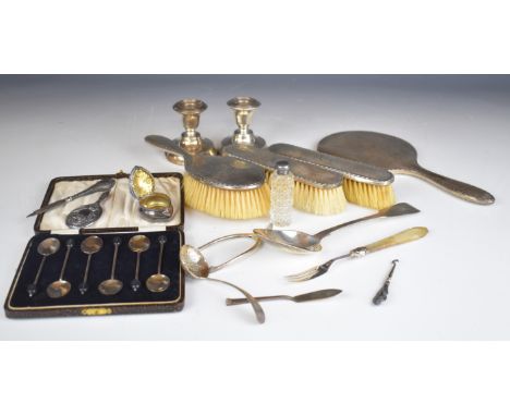 Hallmarked silver items comprising hand mirror, novelty miniature mirror, three brushes, fiddle pattern table spoon, butter k