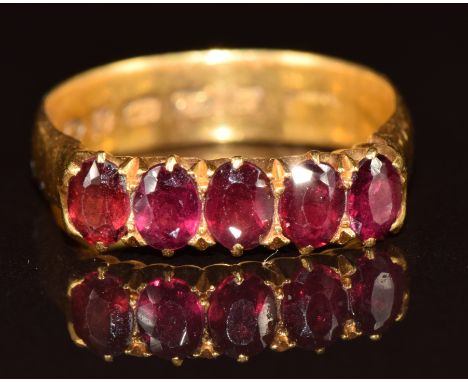 A 22ct gold ring set with five oval garnets, Birmingham 1881, 5.5g, size P