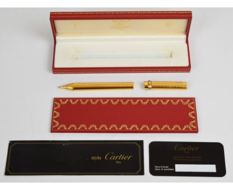 Must de Cartier Stylo Bille ballpoint pen with engraved gold plated body and cap and tri-colour twist decoration, in original