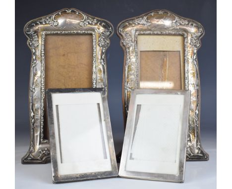 Two pairs of hallmarked silver photograph frames, one of Art Nouveau design, Birmingham 1911/15, maker's marks indistinct, he