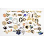 A collection of vintage brooches including agate, two silver filigree, silver set with onyx,