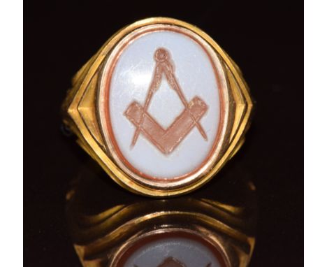 A 15ct gold signet ring set with a carved agate intaglio depicting a Masonic symbol, 6.4g, size L