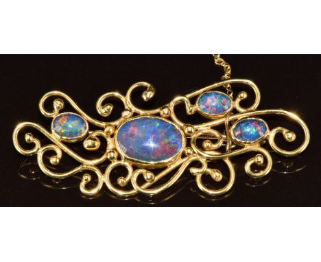 A yellow metal brooch set with four opal triplets (tests as 18k gold), 11.9g, 6cm