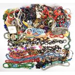A collection of jewellery, mainly beaded necklaces including cinnabar lacquer, faux pearls, glass,