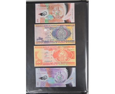 Collection of approximately 200 world banknotes in an album, including Vanuatu, Poland, Krygystan, Switzerland, Iceland, Saud