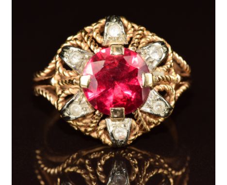 An 18ct gold ring set with a synthetic ruby and quartz, 6.8g, size P