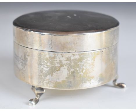 Chinese silver dressing table trinket box of plain circular form with engraved floral decoration to lid, raised on three feet