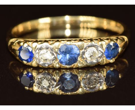 An 18ct gold ring set with sapphires and diamonds, 3.7g, size R