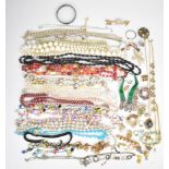 A collection of jewellery including gilt cufflinks, 9ct gold back and front locket with scrolling