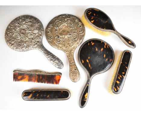 Hallmarked silver and faux tortoiseshell dressing table set comprising hand mirror and two brushes together with two further 