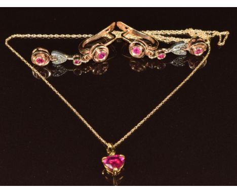 A pair of 14k gold earrings set with synthetic rubies (5.7g) and a 9k gold pendant set with a heart shaped synthetic ruby (1g