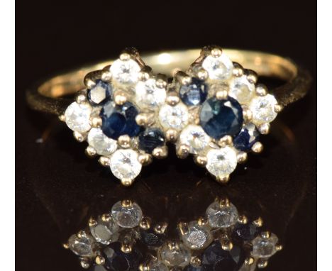 A 9ct gold ring set with cubic zirconia and sapphires, 1.9g, size K