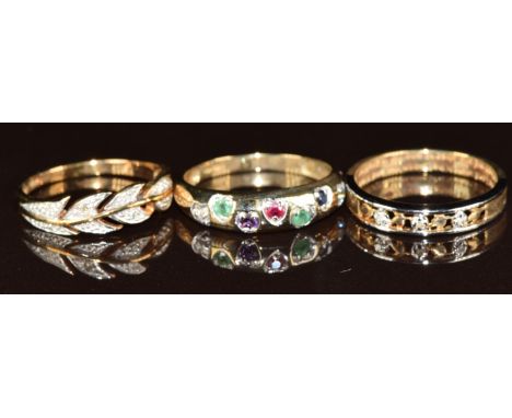Three 9ct gold rings, two set with diamonds and one set with a diamond, emerald, amethyst, ruby, emerald, sapphire and topaz 