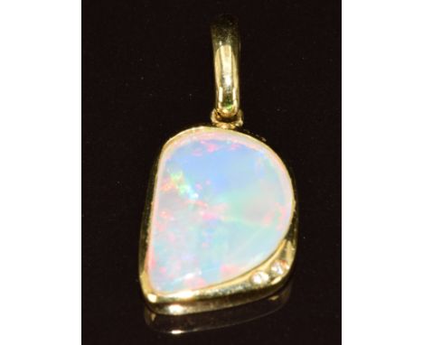 A 18k gold pendant set with an opal and two diamonds, 3.9g, 2.8cm&nbsp;