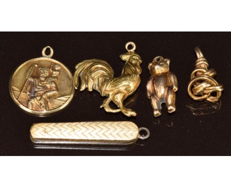 A 9ct gold St Christopher charm / pendant, miniature penknife charm, 9ct gold Teddy bear charm, 9ct gold cockerel charm and a