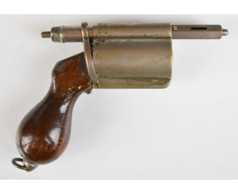 Novelty propelling pencil in the form of a six-shot revolver with wooden handle containing removable lead holder. 13cm long.&