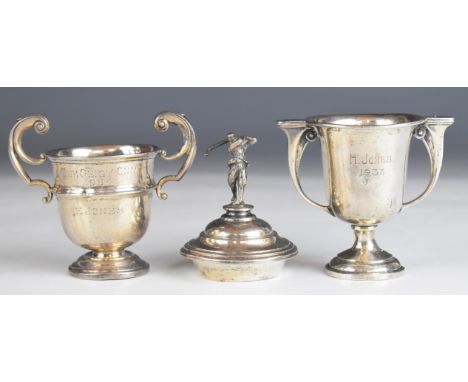 Two hallmarked silver twin handled trophy cups, one with golfer finial and Springfield Park Golf Club enamel badge, possibly 