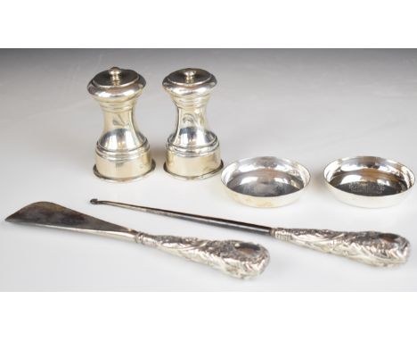 Pair of feature hallmarked silver pin dishes, diameter 8cm, weight 82g, two hallmarked silver mounted pepper grinders and a h