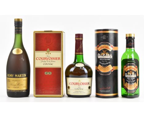 Three bottles of spirits comprising Remy Martin Fine Champagne Cognac VSOP 40% vol 68cl, Courvoisier Luxe Cognac 40% 70cl and