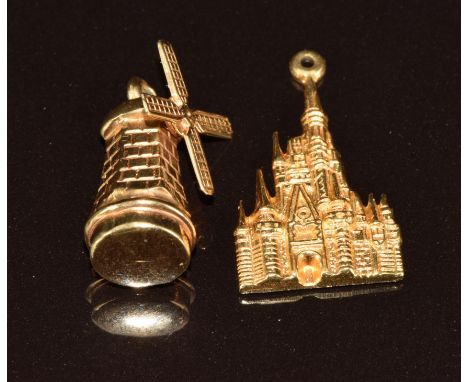 A 14k gold charm in the form of a windmill and a 14k gold charm depicting Walt Disney, 5.3g&nbsp;