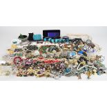 A collection of jewellery including beaded necklaces, peridot and pearl necklace, peridot and