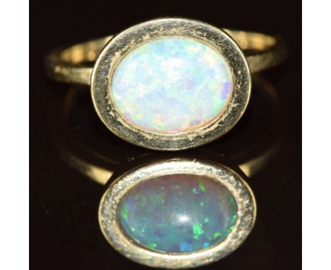 A 9ct gold ring set with a synthetic opal, 4g, size P