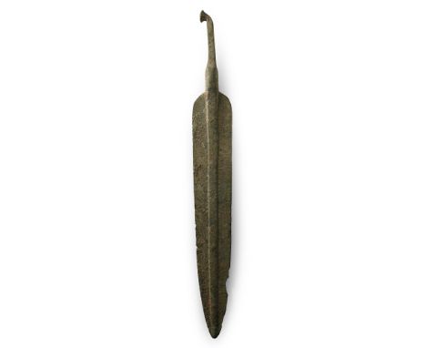 13th-12th century B.C. With large ovate blade, broad midrib, rounded shoulders and rectangular-section tang with bent tip end