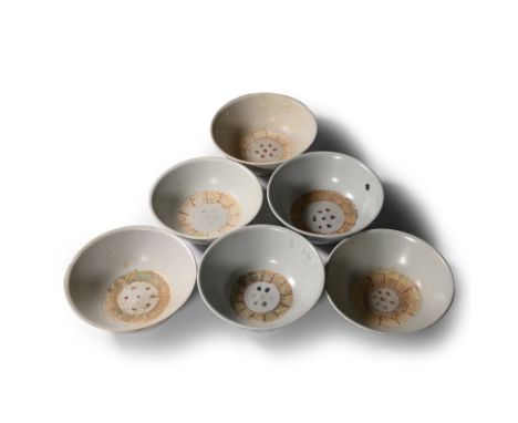 Early 19th century A.D. Comprising six bowls with everted rims, painted polychrome floral and linear motifs.  2.3 kg total, 1