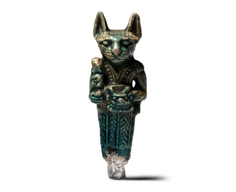 Late Period, circa 664-332 B.C. Modelled in advancing pose wearing a tight-fitting robe, cat-headed, with a sistrum in one ha