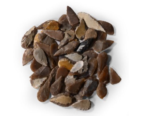 Neolithic Period, circa 6th-4th millennium B.C. Comprising mostly bifacial and uniface flint and chert arrowheads; probably f