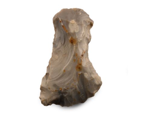 Neolithic Period, circa 6000-4500 B.P Knapped flint with rounded butt and waisted shank, angled blade; old collector's label 