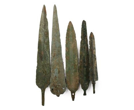 2200-600 century B.C. Comprising four triangular and leaf-shaped blades, one with pierced tang with rivet hole and one pierce