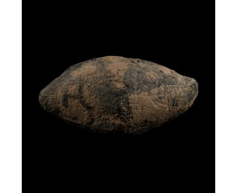 45 B.C. A biconical facetted lentoid-section lead sling shot (glans), inscription monogram a combination of letters 'C', 'A' 