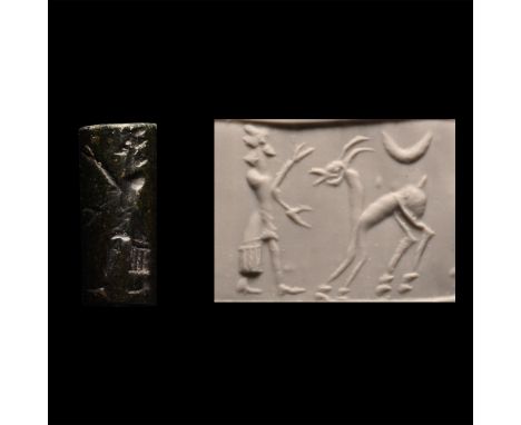 Circa 800-500 B.C. Cylinder with cord and bead handles; accompanied by a copy of an old scholarly note, typed and signed by W