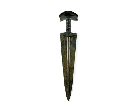 14th-10th century B.C. Triangular blade with raised midrib flanked by shallow grooves extending from the integral lower-guard