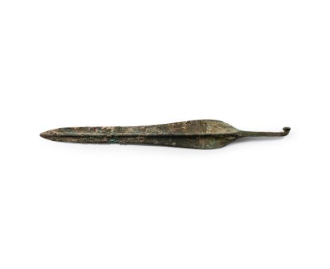 Early 2nd millennium B.C. Having foliate blade with central rib and slender shoulders, short rectangular shaft and tang with 