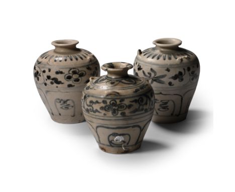 15th century A.D. Comprising three piriform vessels with small trumpet-shaped mouths, remains of loop handles above the shoul
