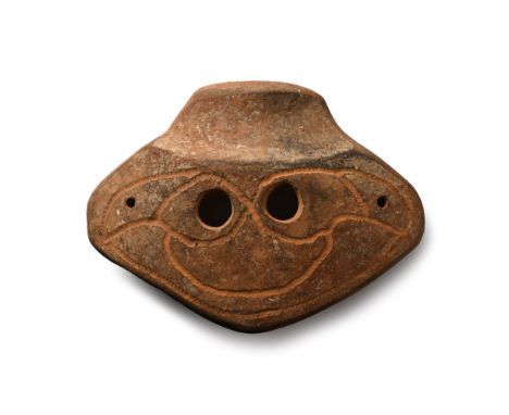 4th-3rd century B.C. or later Slightly curved trapezoid shape with scooped panel and two eye-holes, incised stylised facial d