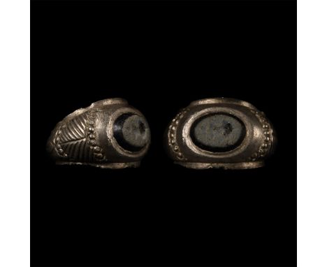 2nd-3rd century A.D. Comprising a D-section fluted hoop with lateral flanges, expanding shoulders with diagonal line design, 