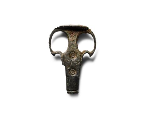 16th century A.D. or later With tubular shank and flared lateral arms, ellipsoid panel above.  3.72 grams, 24 mm (1 in.). [No