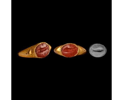 3rd-4th century A.D. Hollow-formed hoop with broad shoulders, shallow cell with inset jasper intaglio of a fish with cross po