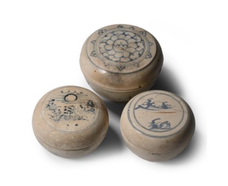 15th century A.D. Comprising three powder boxes: one with a large lotus flower; one showing a hilly landscape; one with a lan