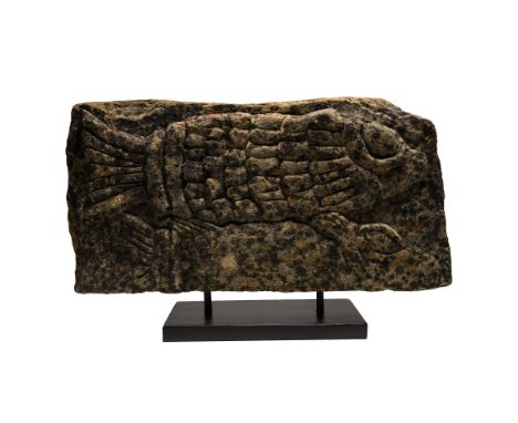 Circa 15th-16th century A.D. or earlier Rectangular block with high-relief carving to the upper face, comprising two fishes p