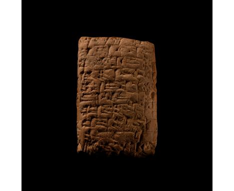 19th-16th century B.C. Pillow-shaped with impressed bands of cuneiform text to both broad faces, one edge and one end. 70 gra