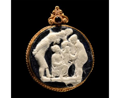 Late 1st century B.C.-1st century A.D. and later Blue glass disc with white glass past overlay imitating onyx, showing the nu